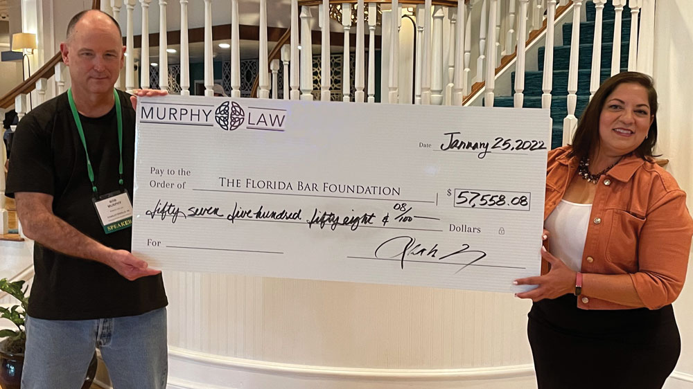 Robert Murphy giving Cy Pres check to the Florida Bar Foundation